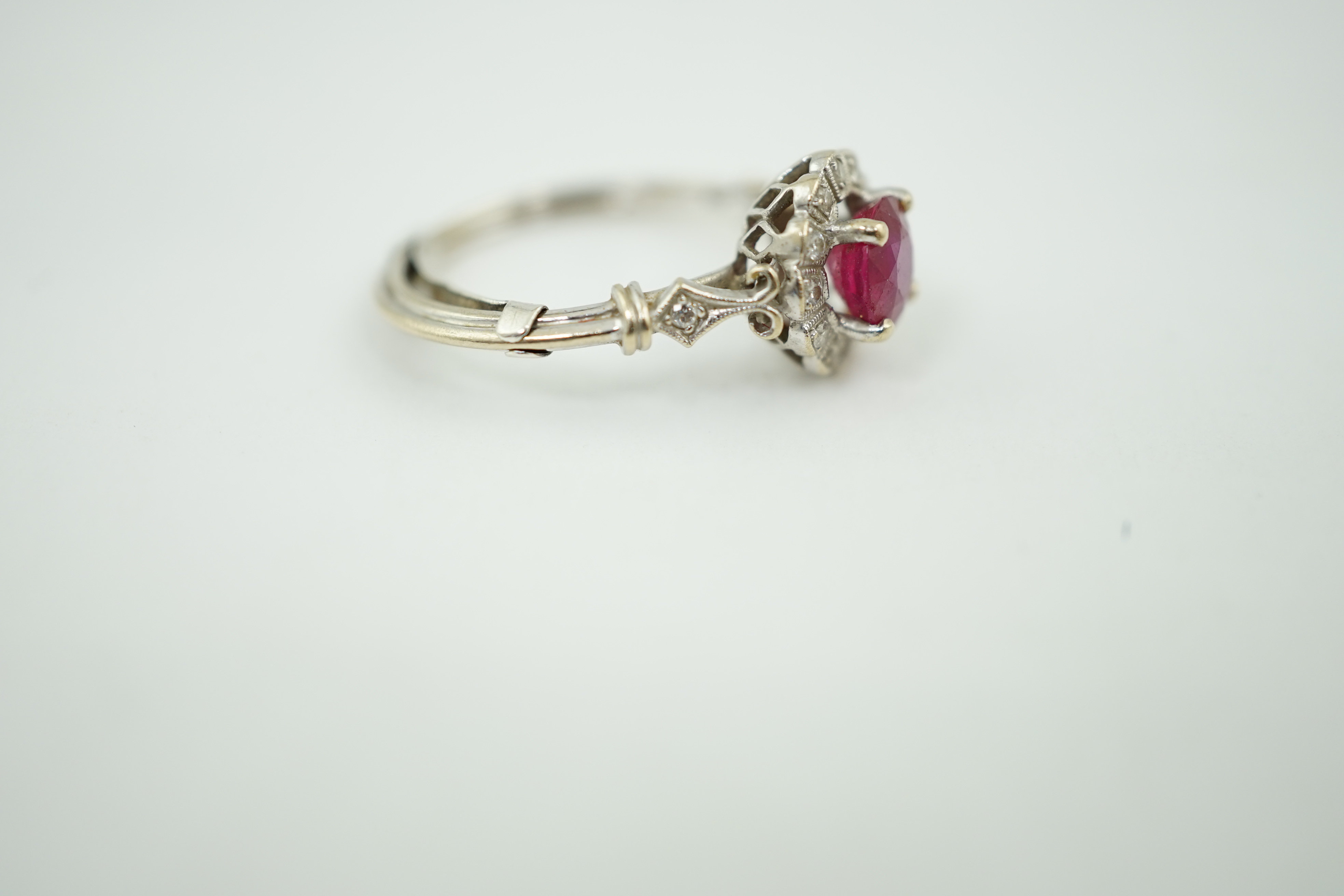 A recent 18ct white gold, ruby and diamond set cluster ring